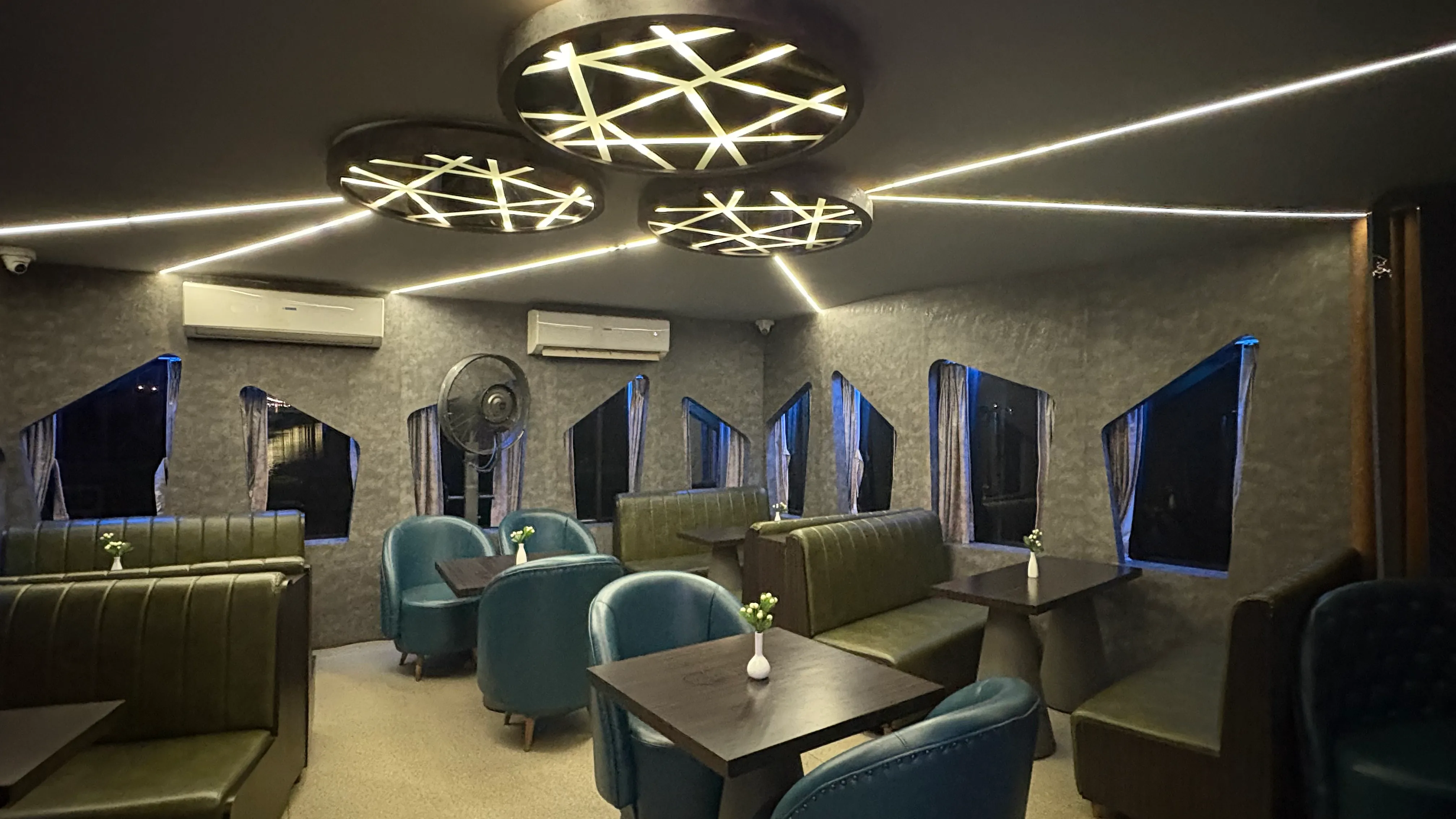 The covered air-conditioned lounge aboard Alfresco Grand
