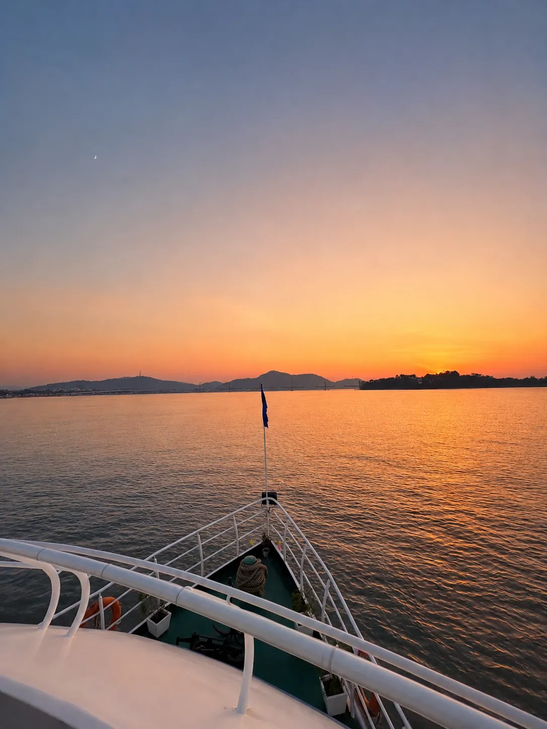 Guest's view of the Brahmaputra sunset from the bow of Alfresco Grand