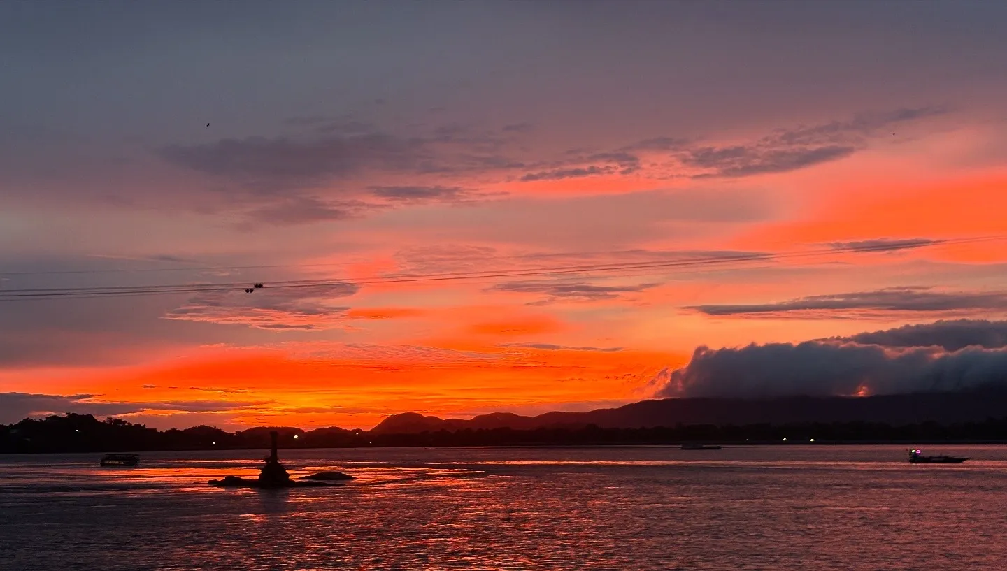 Deep red dusk settling over the Brahmaputra river in Guwahati after sunset