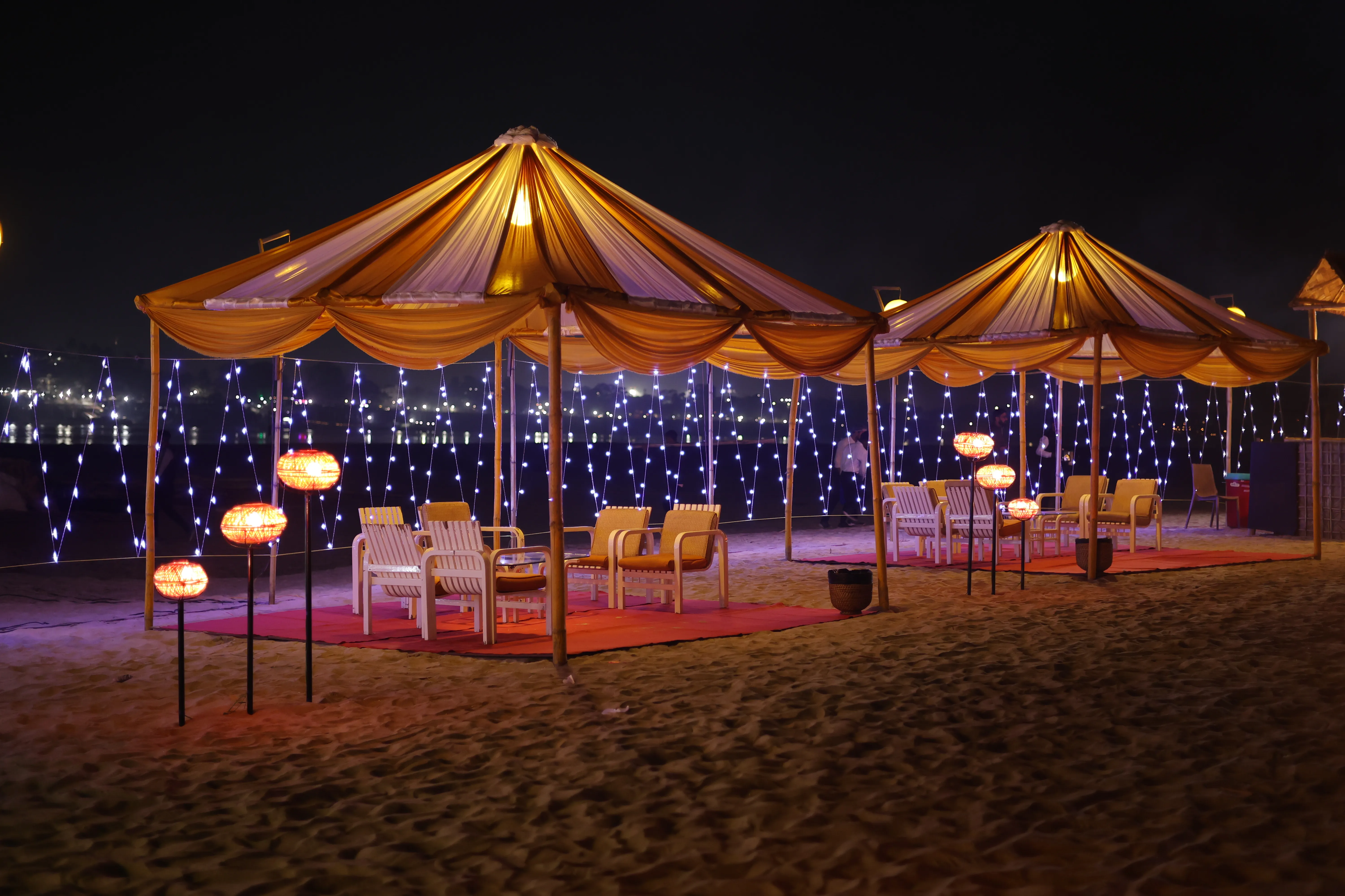 Lounge cabanas set up for guests at a river island celebration
