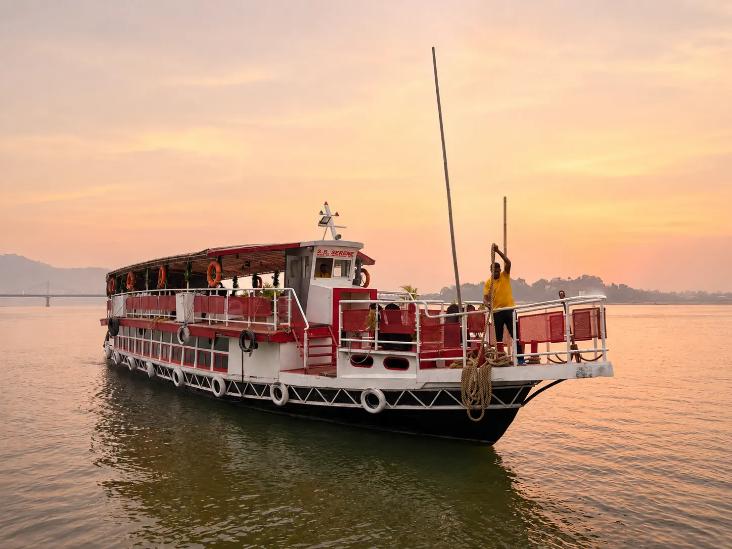 S B Serene, the mid-size charter vessel, on the Brahmaputra at golden hour